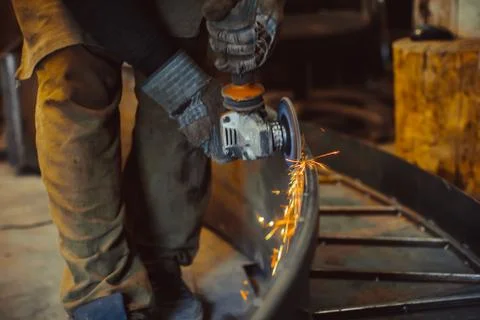 Worker sawing the iron Stock Photos