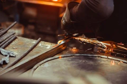 Worker sawing the iron Stock Photos