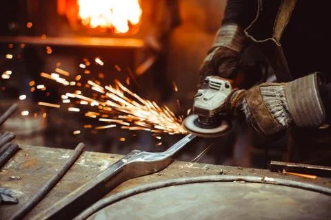 Worker sawing the iron Stock Photos