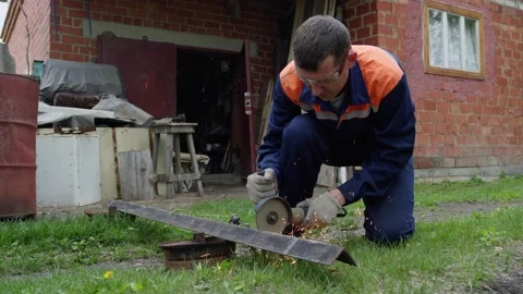 Worker sawing metal Stock Footage 195860555