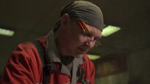 A worker is sawing a tree on a machine. Small home business Stock Footage 149308698