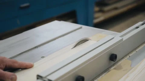 A worker saws a board on a sawing machine Stock Footage 155211528