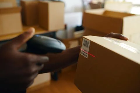 Worker Scanning Barcode On Box Stock Photos