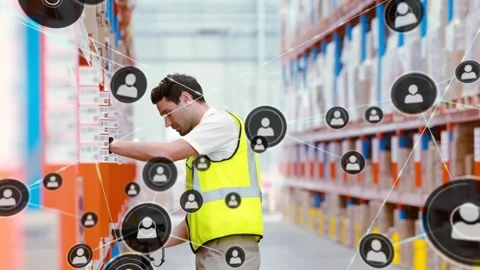 Worker scanning barcodes in warehouse, updating stock, causing network icons to Stock Footage 330622062