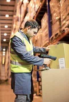 Worker scanning box in warehouse Stock Photos