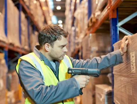 Worker scanning boxes in warehouse Stock Photos