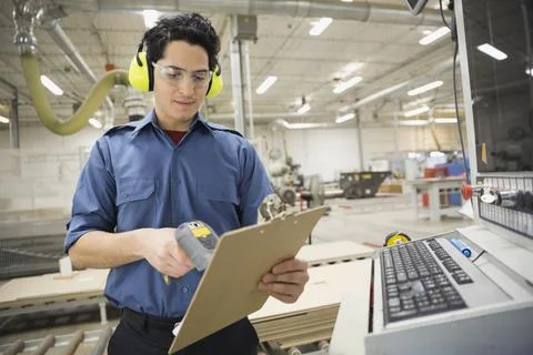 Worker scanning document in warehouse Stock Photos