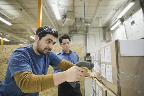 Worker scanning inventory in warehouse Stock Photos