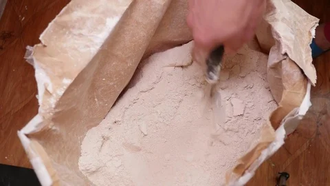 Worker Scoops Dry Plaster with a Spatula Stock-Footage 77506852