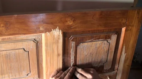 Worker scratching the paint of the door Stock Footage 68233940