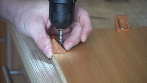 Worker screwed a screw with a screwdriver Stock Footage 124358529