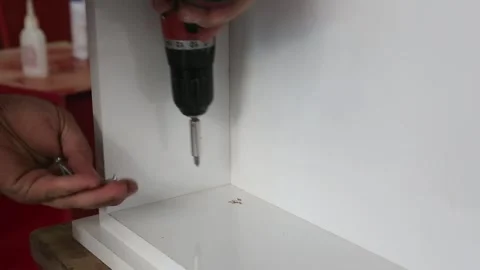Worker Screwing Cabinet Panel Close-Up Stock Footage 340108750