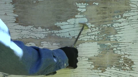 Worker scrubbing off peeling paint, 4K Stock Footage 61799818
