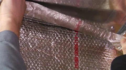 Worker seals a vent repair using tape Stock Footage 42963935