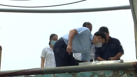 Worker Selects Key to Open Wastewater Tank During Inspection Stock Footage 344950351