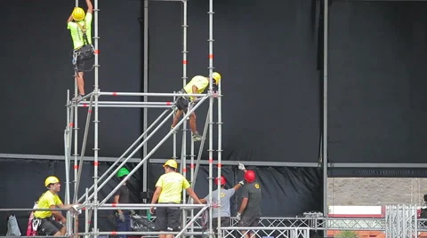Worker set up the stage for the live music event 動画素材 56985505