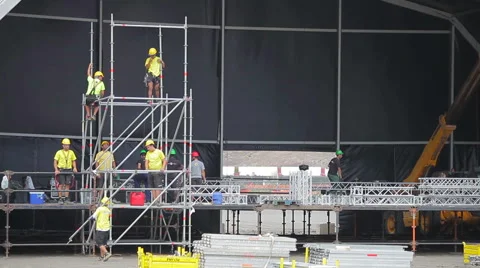 Worker set up the stage for the live music event. Stock Footage 57013504
