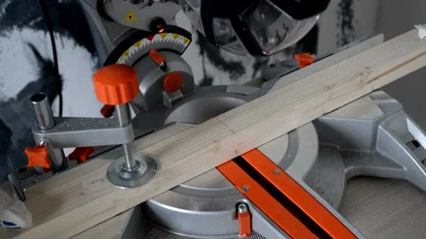 The worker sets the board on the circular saw. Logging, construction, production Stock Footage 148940515