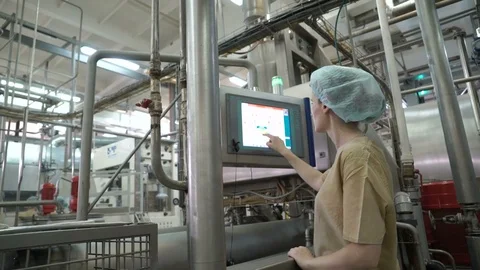 Worker sets the program on the display. Production line for the production of Video stock 74183195