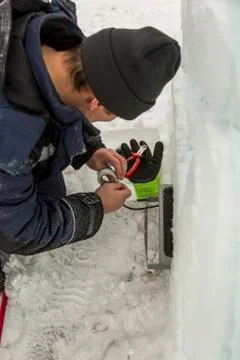 Worker sets the spotlight in the ice figure 스톡 사진