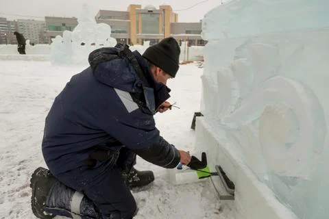 Worker sets the spotlight in the ice figure 写真素材