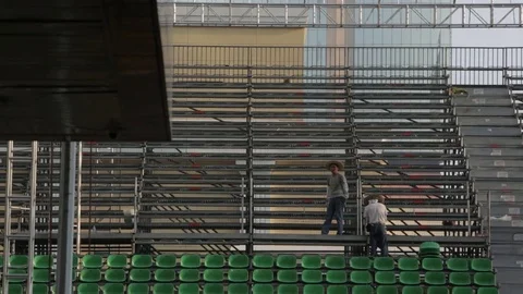 A worker setting up chairs for the Grand Prix of Macao Stock Footage 75212942