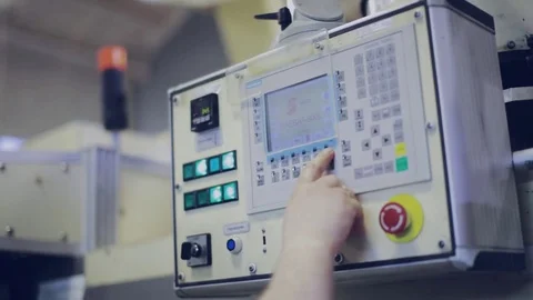 Worker is Setting Up CNC Machine in Factory. Stock Footage 75222488