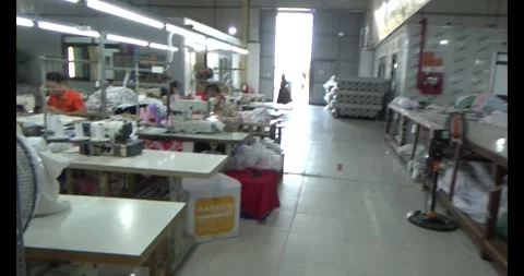 Worker sewing clothes in factory Stock Footage 292913035