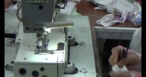 Worker sewing clothes in factory Stock Footage 292913177