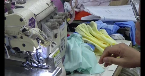 Worker sewing clothes in factory Stock Footage 292913647