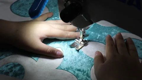 Worker sewing on a sewing machine Stock Footage 297194462