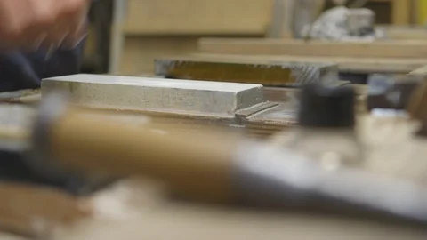 Worker sharpening his tools on the slab Stock Footage 87800878