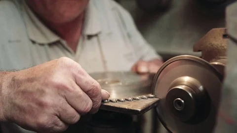 Worker sharpens a circular saw blade – medium shot Stock-Footage 75708267