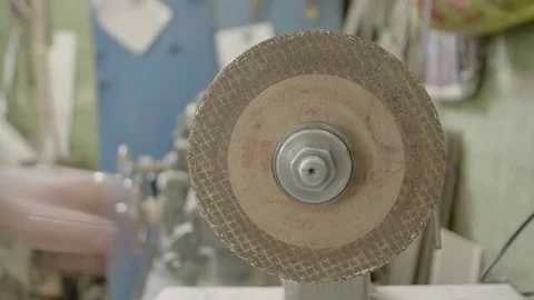 The worker sharpens the tool. Work on a sharpening machine. Stock Footage 81697505