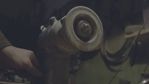 The worker sharpens the tool. Work on a sharpening machine. Stock Footage 81697892