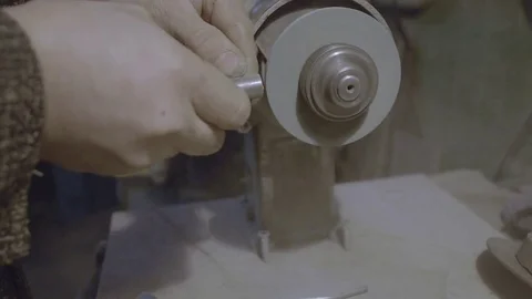 The worker sharpens the tool. Work on a sharpening machine. Stock Footage 81698125
