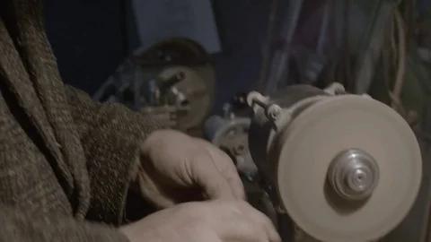 The worker sharpens the tool. Work on a sharpening machine. Stock Footage 81698413