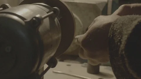 The worker sharpens the tool. Work on a sharpening machine. Stock Footage 81698472