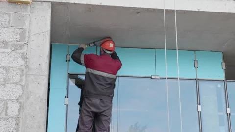 Worker shoots seams on door structure 10.06.2020 Stock Footage 132494139