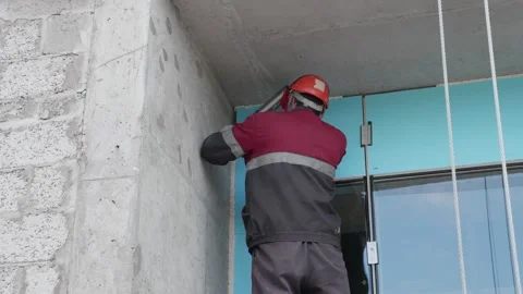 Worker shoots seams on door structure 10.06.2020 Stock Footage 132494167