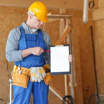 Worker showing document at site Stock Photos