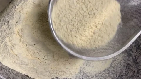 Worker sieving the flour on the pizza preparation Stock Footage 235635888