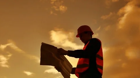 Worker silhouette worker builder man with red helmet and jeans shirt near a Stock Footage 89853256