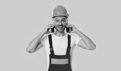 Worker at site. Builder construction man. Builder engineer isolated on yellow Stock Photos