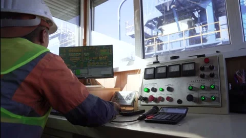 Worker sitting in control cabin on a plant Stock Footage 171464053