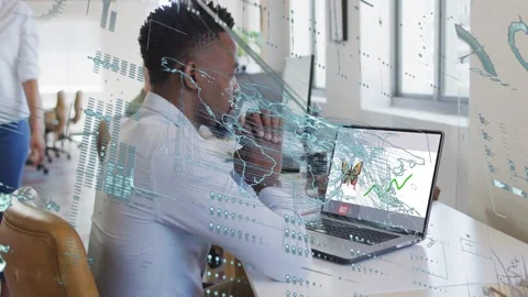 Worker sitting viewing laptop NFT while map and rising graph aligning with Stock Footage 328384392
