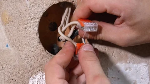 Worker Skillfully Linking Wires Into Round Junction Container Stock Footage 328521516