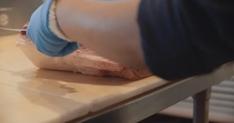 Worker Slicing Meat In Slow Motion 스톡 동영상 105340337
