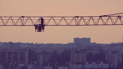 Worker sliding on crane sunset Video stock 92630513