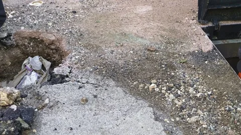 Worker slips fiber optic cables into underground corrugated pipe Video stock 252600590